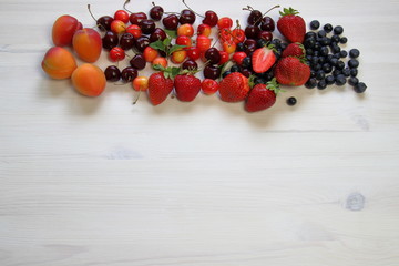 Naklejka na ściany i meble fruit on a light wooden table