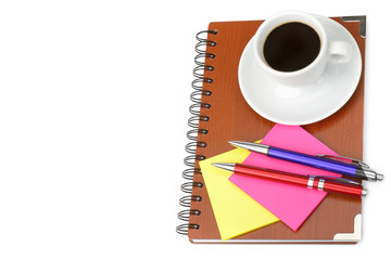 Notebook and cup of coffee isolated on white background. Free space for text.