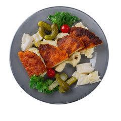 Fillet of fried fish with cabbage on white background