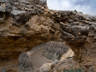 A View of the Bighorn Canyon Through a Stone Arch