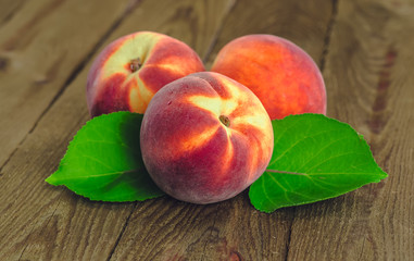 fresh peaches on wooden table
