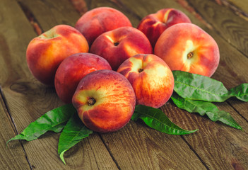 fresh peaches on wooden table