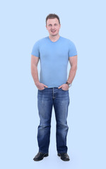 full-sized portrait.the guy in jeans and a t-shirt.