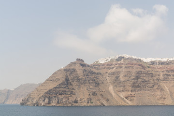 Cliffs of Santorini island with Fira town on top, Greece