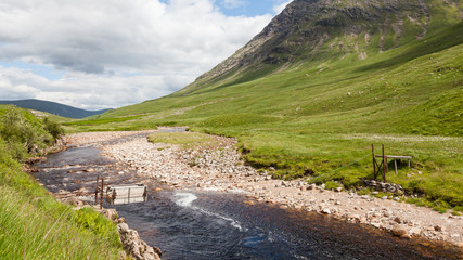 Sheep Transporter.  A sheep transporter is pictured crossing the River Etive in Glen Etive, a glen in the Scottish Highlands.