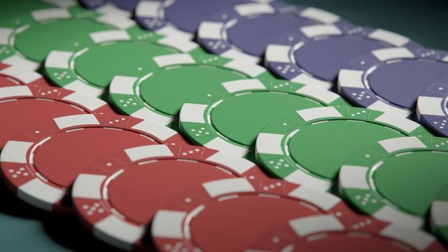 Jackpot. Casino chips in a neat rows on a gaming poker table. Loopable video