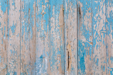 Rough and shabby wood pattern with peeling blue paint