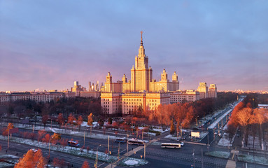Wide angle panoramic view of sunset Moscow university campus under dramatic sky in spring