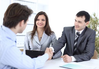 Fototapeta premium handshake business partners in the workplace