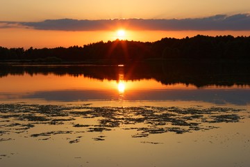 Fototapeta na wymiar View on a lake during sunset