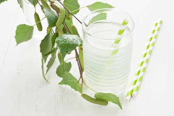 Glass birch juice / Glass of fresh birch juice, water drops and birch branch