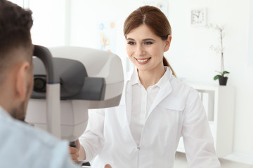 Fototapeta premium Ophthalmologist examining patient in clinic