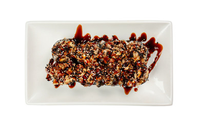 Plate with tasty maki rolls on white background, top view