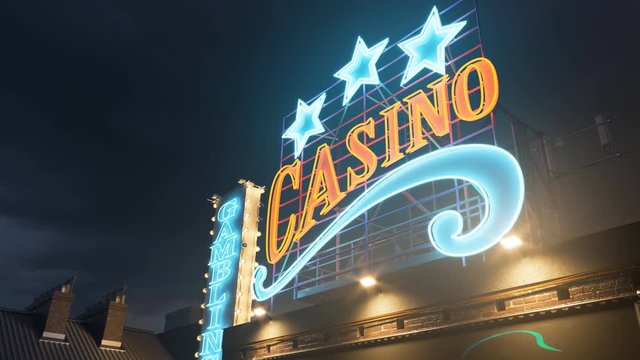 Retro Casino neon light on the roof of building at night. Las Vegas, gambling