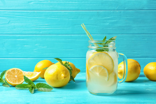 Natural lemonade in mason jar on wooden table