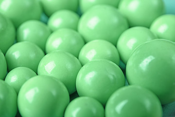 Smooth round beads in mint color, closeup