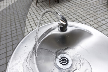 flowing water fountain made with chrome and sliver stainless steel