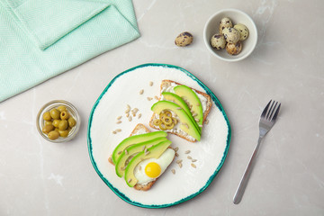 Tasty breakfast with crisp avocado  toasts on table, top view