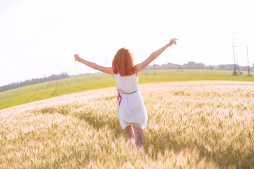 Fototapeta premium girl at the wheat field