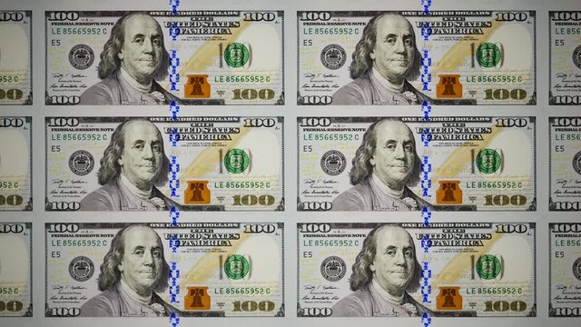 Seamless animation of uncut sheets of new 100 dollars banknotes stacking process