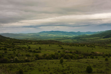 Fototapeta premium low clouds green landscape