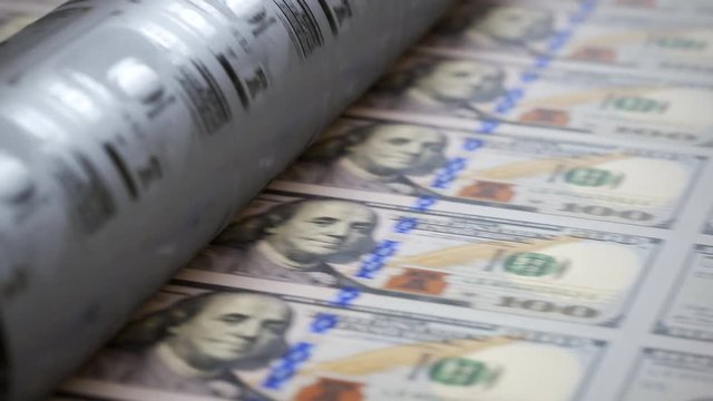 Rotary printing press working process. 100 USD, hundred dollar uncut banknotes