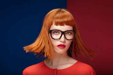 Colorful portrait of redhead woman.