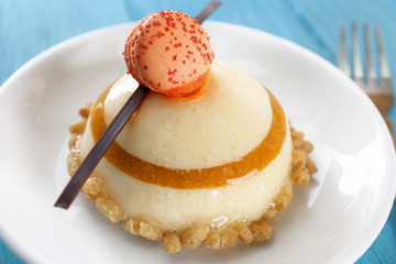 Plate with tasty cake on table, closeup