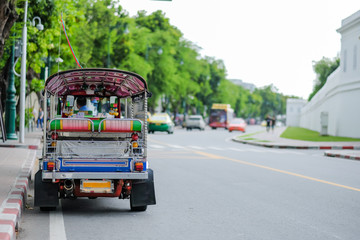 Fototapeta premium Tuk Tuk (Thai traditional taxi car) parking for wait a tourist passenger, sightseeing in Bangkok, Thailand