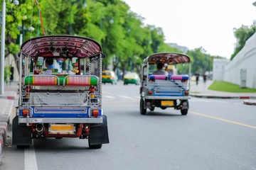 Tuk Tuk (Thai traditional taxi car) parking for wait a tourist passenger, sightseeing in Bangkok, Thailand