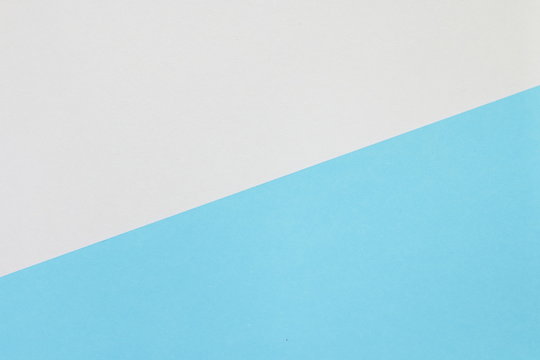 Two color paper with blue and white Overlap on the floor And split half of the image. background