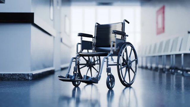 Abandoned wheelchair in empty, clean hospital waiting corridor. Disability in 4K