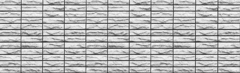 Panorama of Grey stone brick wall pattern and background