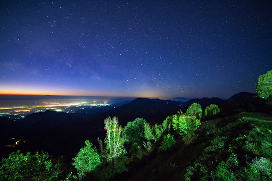 Fototapeta Starry night sky at Monson viewpoint Doi AngKhang and milky way galaxy with stars and space dust in the universe