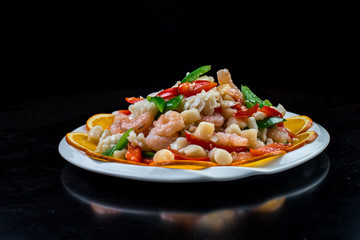 Chinese cuisine. Colorful stir fry in a wok. Shrimps with vegetables