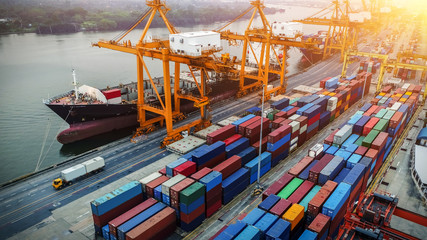 Logistics and transportation of Container Cargo ship and Cargo plane with working crane bridge in...
