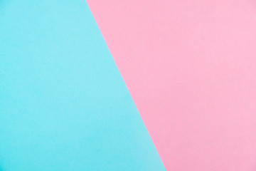 Pastel colored paper flat lay top view, background texture, pink and blue.