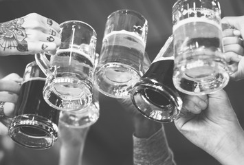 People making a toast with beers