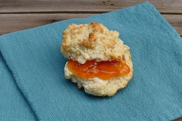 Apricot preserves on homemade biscuit