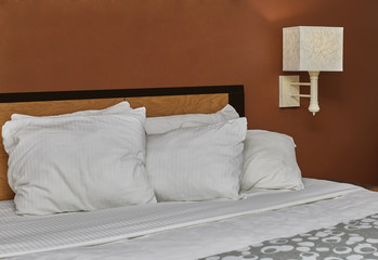 White Down Pillows on a Bed
