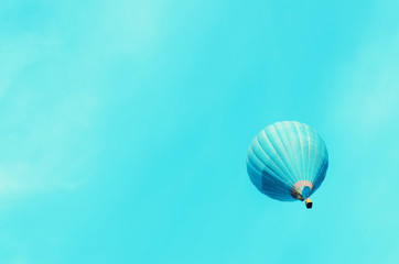 Travel, summer and tourism concept. Trip, journey background. Blue hot-air balloons flying over sky. Copy space