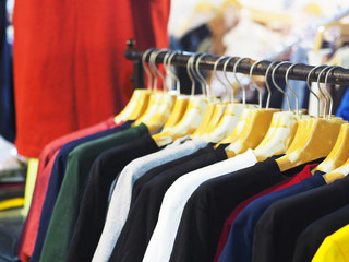 Colorful T shirt hanging on cloth hanger