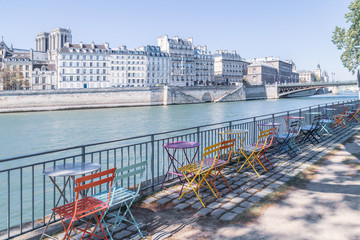 Empty outdoor cafe on the banks of the Seine.