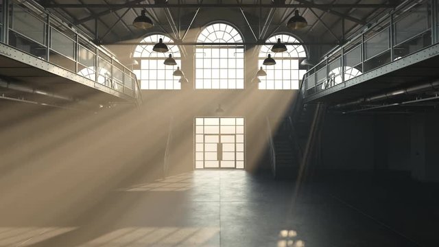 Loft hall interior illuminated by a beam of sunlight entering through windows.