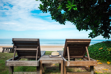 summer background beautiful beach have hat place on wood table near sea and blue sky