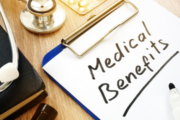 Medical Benefits handwritten on a clipboard.