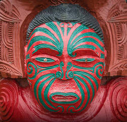 The cropped shot view of the traditional Maori wood carving statue in New Zealand.