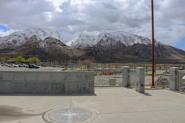 A view of a marina located on the Great Salt Lake with the beautiful snow-capped Rocky Mountains in the background, Great Salt Lake State Park Utah.