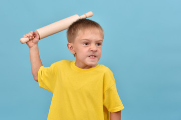 The boy is fighting. Bad child. Evil teenager.