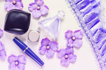 Beautiful cosmetic jars and boxes with flowers hydrangeas and pearls on white background